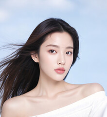 Portrait of an elegant Asian woman with delicate hairstyle, hair blown up by the wind, one hand on the chest, for beauty salon, skin care, plastic surgery agency, dermatology poster modeling