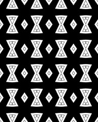 Intricate geometric shapes create a seamless pattern in black and white, perfect for textiles, wallpapers, and graphic designs