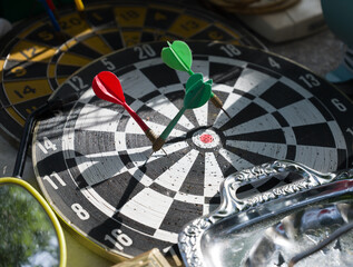 An old Dart Board and Darts at a Flea Market