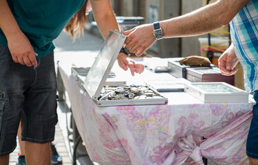 A person looking for some deals in a flea market