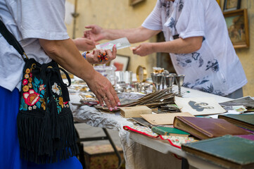 A person looking for some deals in a flea market