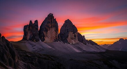 Dramatic Dolomites Tre Cime Peaks Bathed in Fiery Sunset Light.