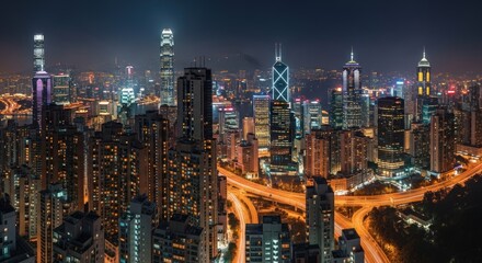 Naklejka premium Night cityscape featuring illuminated skyscrapers and highways in a densely populated urban area