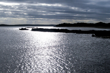 Tranquil view of blue and silver over a sheltered bay in the Inhaca barrier Island system of...