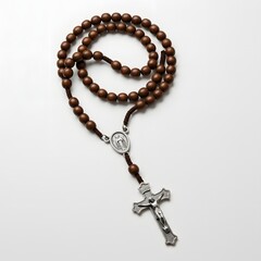 A classic rosary lies gracefully, showcasing its intricate design of wooden beads and a detailed crucifix. A symbol of faith and devotion, evoking a sense of spiritual contemplation and reflection.