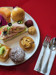 colorful plate of gourmet pastries and savory snacks, featuring variety of textures and flavors, perfect for delightful brunch experience
