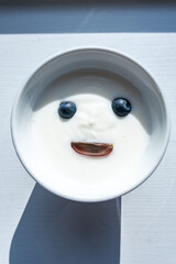 Mors, Denmark A bowl of yogurt with blueberry eyes. © Alexander