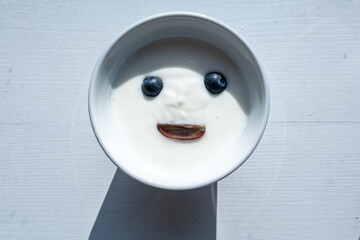 Mors, Denmark A bowl of yogurt with blueberry eyes. © Alexander