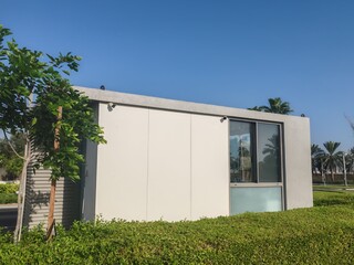 Security Booth Container with Glass Window on both side. Security Eneterence Checking Control Point Outdoor. Full View Portable container House or Home Cabin having Gray color for control Traffic.