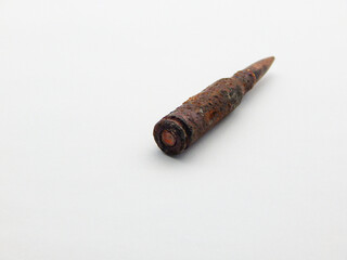 Rusty weapon cartridge.