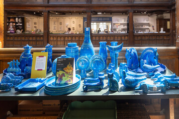 London, UK, 12 May 2025, Liberty shop.   Collection of vibrant blue glass art and decor.