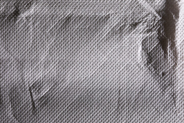 Crumpled dark tissue paper macro material texture