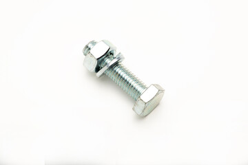 A close-up of a metallic bolt with a nut, showcasing its threaded design and hexagonal head. The...