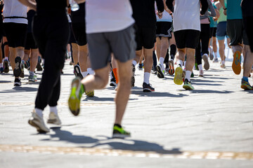 Large group of athletes running marathon