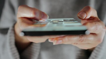 Woman scrolling through social media feeds on smartphone close up - Powered by Adobe