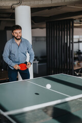 A joyful business worker plays table tennis in a modern office setting, enjoying a casual and relaxed work environment. The scene promotes workplace wellness and camaraderie.