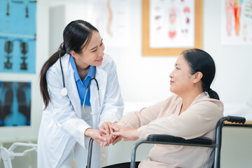 experienced female medical professional explains test results to a female patient during a clinic consultation. reviewing reports and discussing diagnosis and treatment options.compassionate care