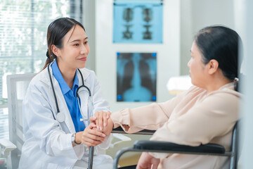 experienced female medical professional explains test results to a female patient during a clinic consultation. reviewing reports and discussing diagnosis and treatment options.compassionate care