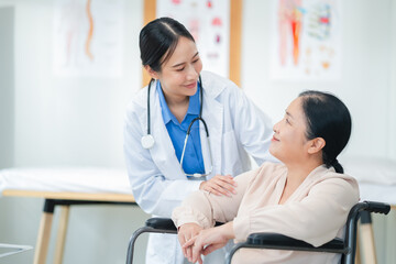 experienced female medical professional explains test results to a female patient during a clinic consultation. reviewing reports and discussing diagnosis and treatment options.compassionate care