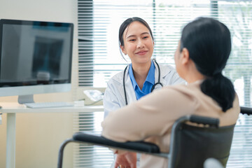 experienced female medical professional explains test results to a female patient during a clinic consultation. reviewing reports and discussing diagnosis and treatment options.compassionate care