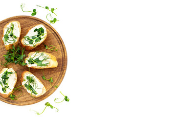 Plate of sandwiches with cream cheese and micro greens peas. Healthy food, top view