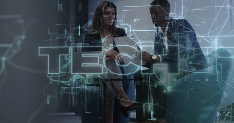 Reviewing business professionals discussing printed documents in office lounge, with TECH graphics
