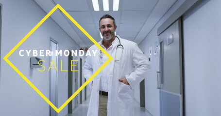 Standing bearded doctor wearing lab coat in hospital corridor, featuring Cyber Monday Sale graphic