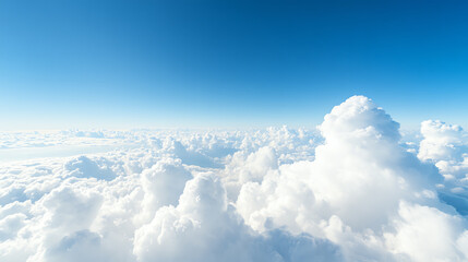 A breathtaking view of white fluffy clouds against a vibrant blue sky, representing the beauty of nature and tranquility.