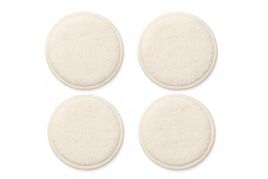 Four reusable makeup remover pads on transparent background