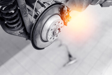 Car wheel service with brake disc and caliper highlighted