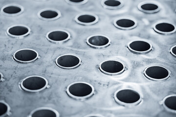 Close-up of heat exchange pipes with metallic surface and welded connections