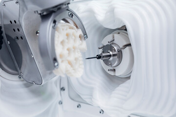 Cnc machine crafting dental prosthesis with precision technology