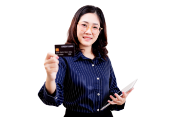 Asian young beautiful woman wearing glasses and a striped shirt is holding a credit card in one hand and a tablet in the other, smiling confidently.