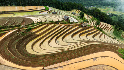 Water season flows into terraced fields and rice planting begins in Mu Cang Chai, Yen Bai. Photo...