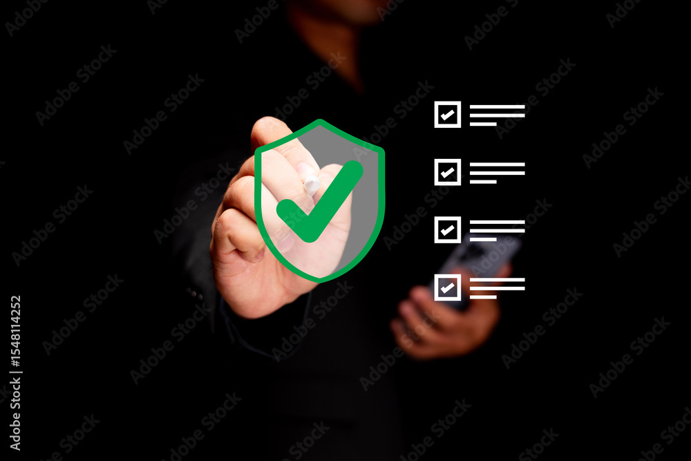 Poster a person in black marks a green checkmark on a digital shield icon, symbolizing security and verifie