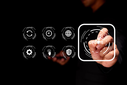 A person interacts with a futuristic digital interface featuring icons and a highlighted "UPDATE" button with a gear symbol.