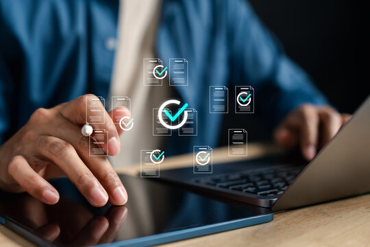 Document checklist and digital online form concept for data entry, electronic approval, form submission, and workflow management system in modern office with hand using laptop.