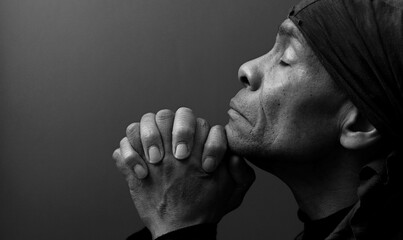 man praying to God Caribbean man praying with background stock image stock photo	