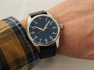 Minimalist Pilot Style Wristwatch with Black Dial on Man's Wrist