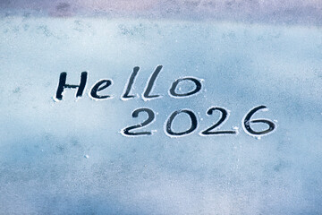 Hello 2026 on a frozen car window. The inscription hello 2026 among ice and frost. © Сергей Дудиков