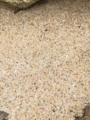 Old brown stone wall texture with natural rock patterns and detailed surface