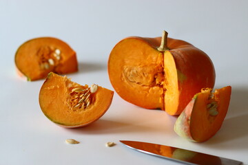 Sliced Orange pumpkin pieces. Vibrant close up of a fresh orange pumpkin with natural texture