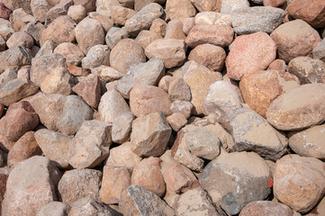 Pile of big stones close up as background