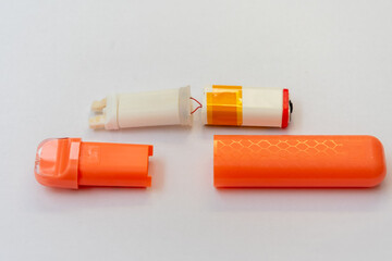 A disassembled vaping device - a view of the electronics, filters and shells.