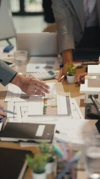 Corporate team discussing commercial property growth strategy at workplace environment