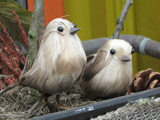 Close up of handmade birds on display 