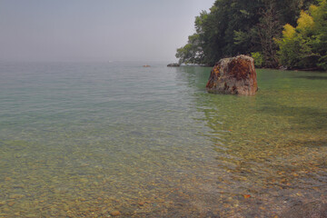 Bay with rock in Lake Geneva. Yvoire, France