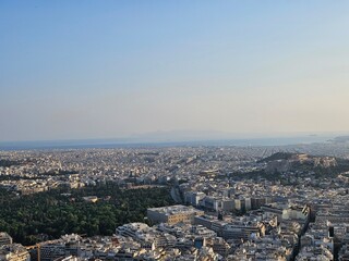 Sunset in Athens with a view of the mountains and the setting sun