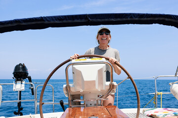Mature woman sailing in Costa Brava, enjoying active lifestyle in Spain