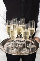 Champagne Flutes on Tray at Formal Event